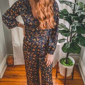 All in Favor Blue Floral Jumpsuit with V-Neck and Long Sleeves